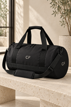 CRAMPFIT black gym bag, front three-quarter view showing CF logos, dual handles and shoulder strap.