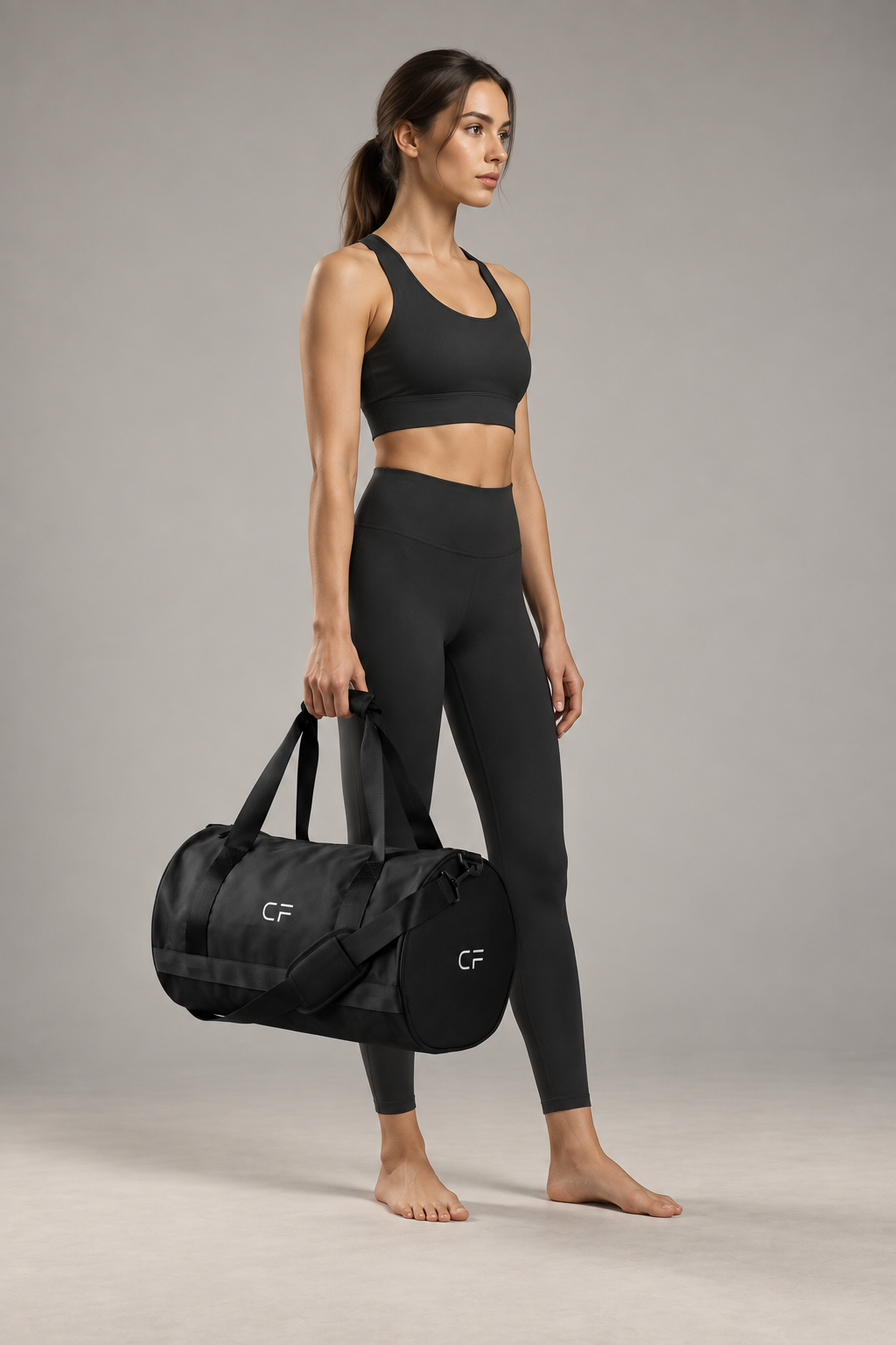 CRAMPFIT black gym bag carried by woman in full-body editorial activewear photo