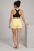 CRAMPFIT Women's High Rise Pocket Yoga Shorts - Yellow - Back view on model