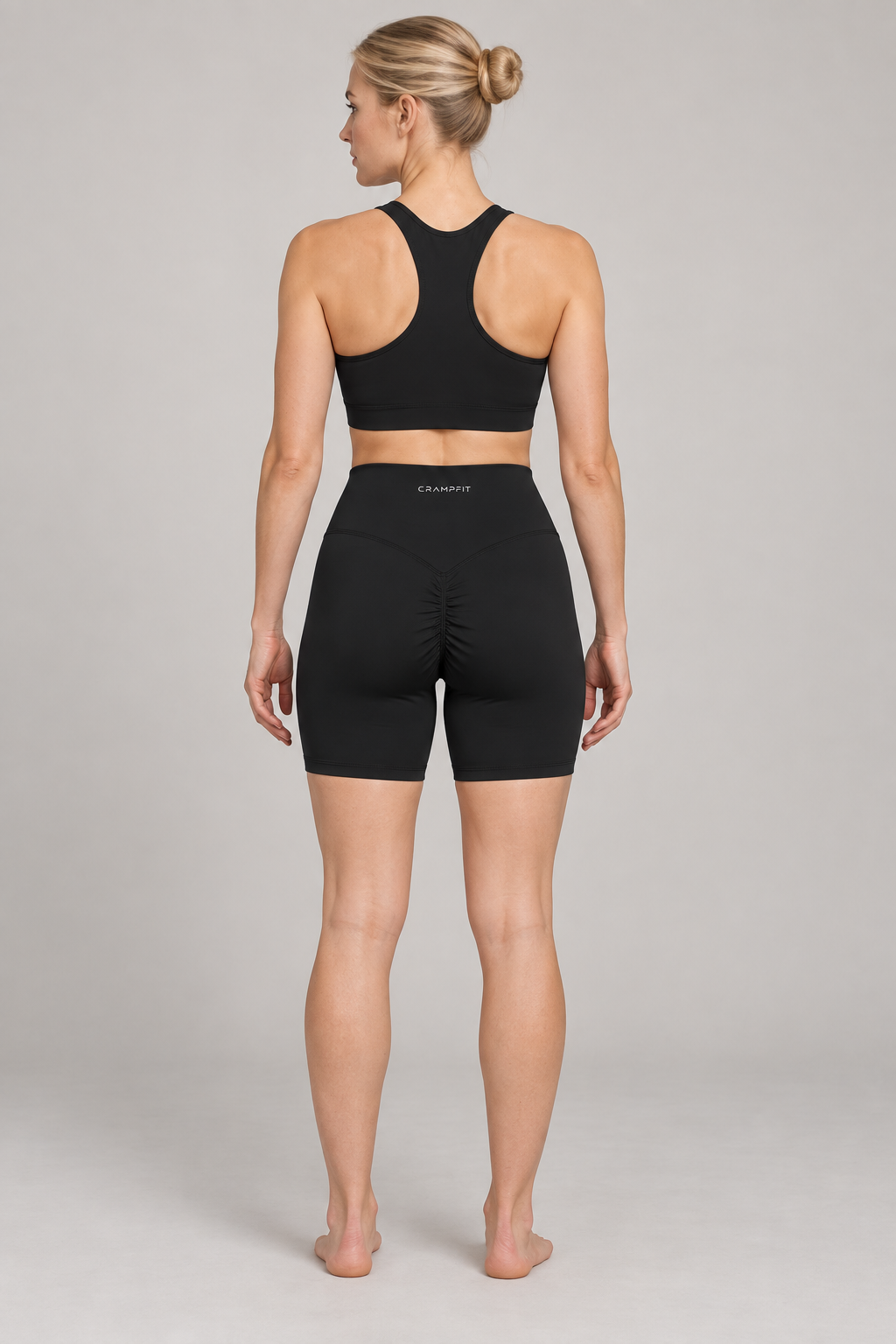 Women’s High Waisted Yoga Biker Shorts - Black - back on model