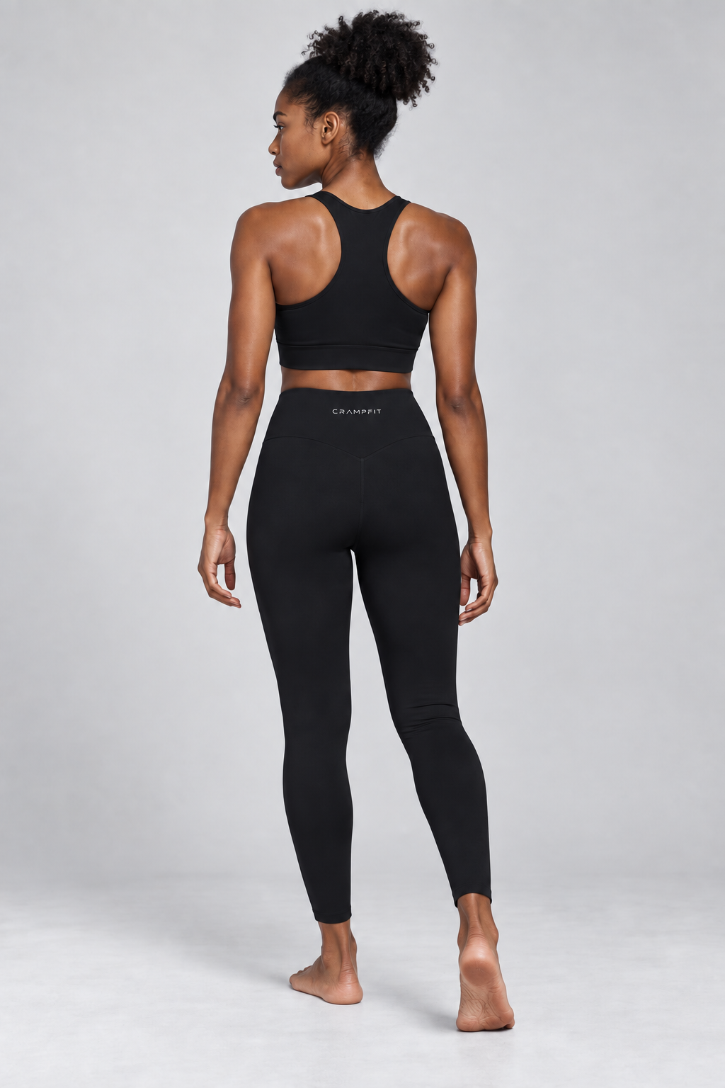 CRAMPFIT High-Waisted Yoga Leggings - black back view on barefoot model