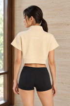 CRAMPFIT Quarter-Zip Crop sweatshirt in cream, back view with CRAMPFIT logo and cropped hem