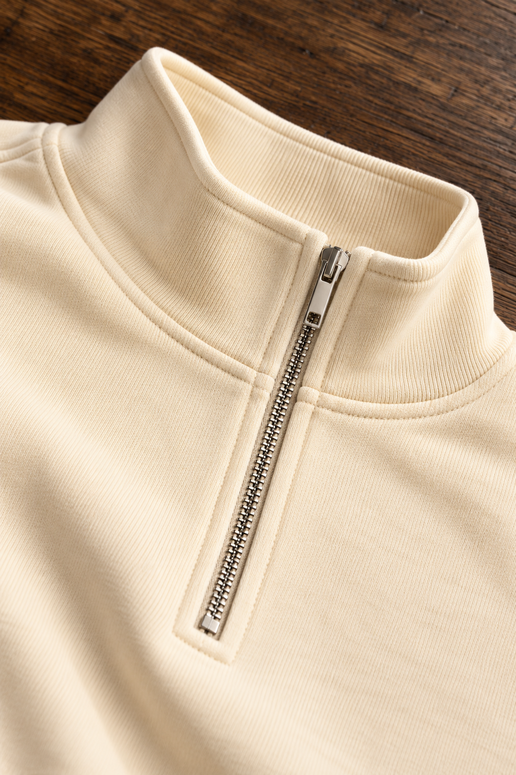 CRAMPFIT Quarter-Zip Crop sweatshirt in cream, stand collar, silver zipper and fabric close-up