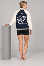 CRAMPFIT Contrast Raglan Sleeve Baseball Jacket in navy with apricot — back view on model