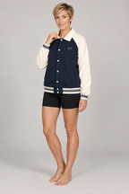 CRAMPFIT Contrast Raglan Sleeve Baseball Jacket in navy with apricot — front view on model