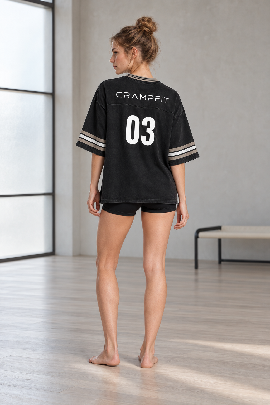 CRAMPFIT women's black boxy jersey, full-body back view showing CRAMPFIT lettering and number 03.