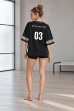 CRAMPFIT women's black boxy jersey, full-body back view showing CRAMPFIT lettering and number 03.