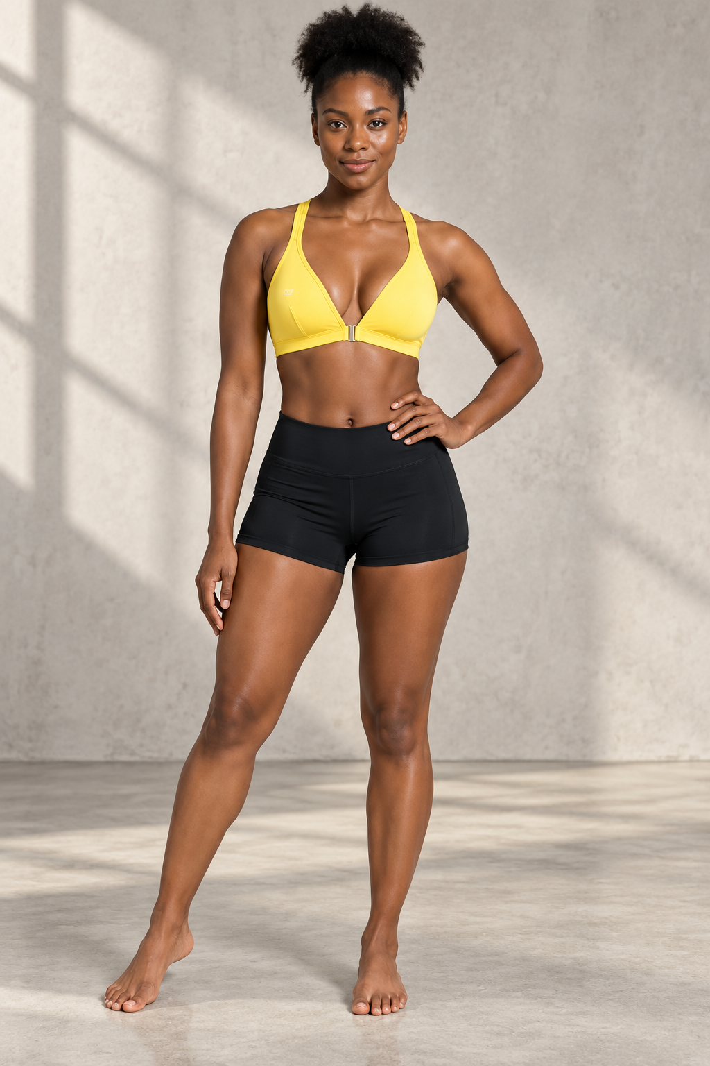 CRAMPFIT women's cross-back yoga sports bra in yellow, front view showing the V-neck and center-front fastening, styled with black workout shorts.