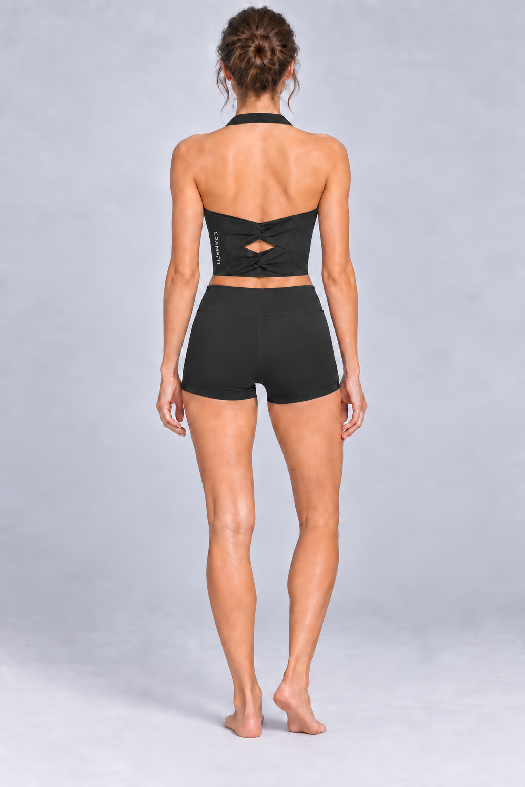 CRAMPFIT Women's Halter Yoga Sports Bra in black — back view on model