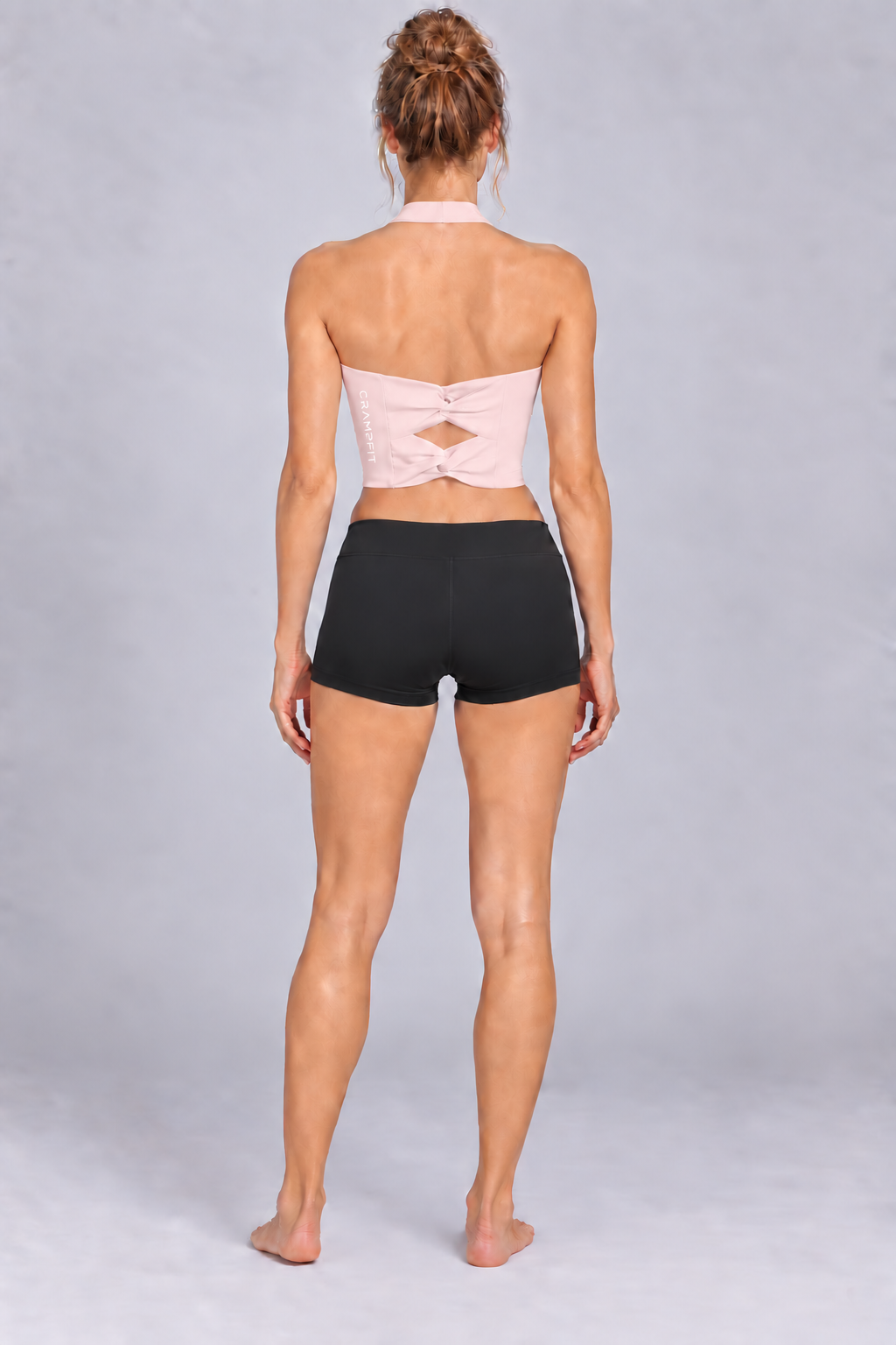 Women's Halter Yoga Sports Bra Light Pink - back view on barefoot model