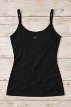 CRAMPFIT women's open-back performance tank in black, flat-lay detail of the cotton fabric, neckline and hem.