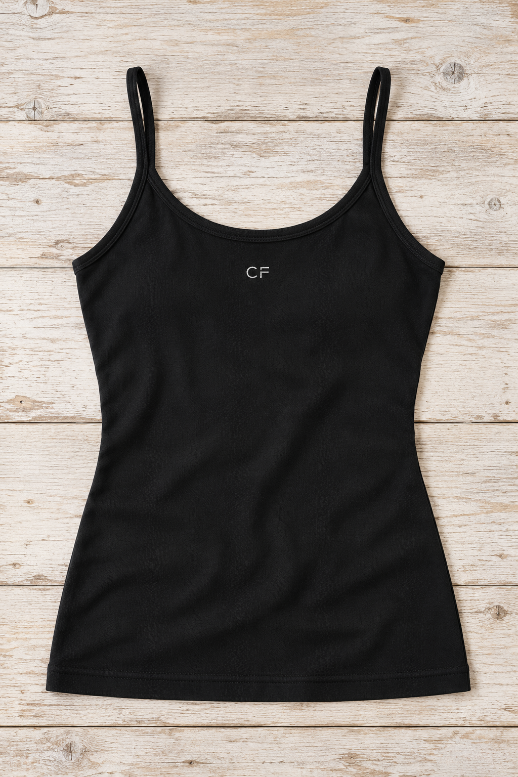 CRAMPFIT women's open-back performance tank in black, flat-lay detail of the cotton fabric, neckline and hem.