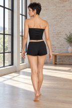 CRAMPFIT women's ruched yoga tube top in black, back view showing the gathered fabric and CRAMPFIT logo.