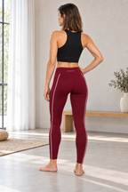CRAMPFIT women's burgundy Sculpt Legging, full-body rear view showing waistband and white contour piping, styled with a black crop tank.