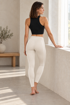 CRAMPFIT women's cream Sculpt Legging, full-body rear view showing waistband and white contour piping, styled with a black crop tank.
