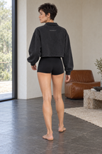 CRAMPFIT women's vintage wash crop sweatshirt in black, back view showing the washed cotton, cropped cut and CRAMPFIT logo.